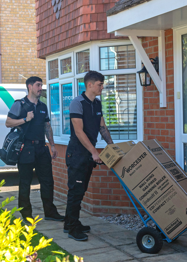 A new Worcester Bosch boiler being delivered and installed by two Diamond Green Energy engineers